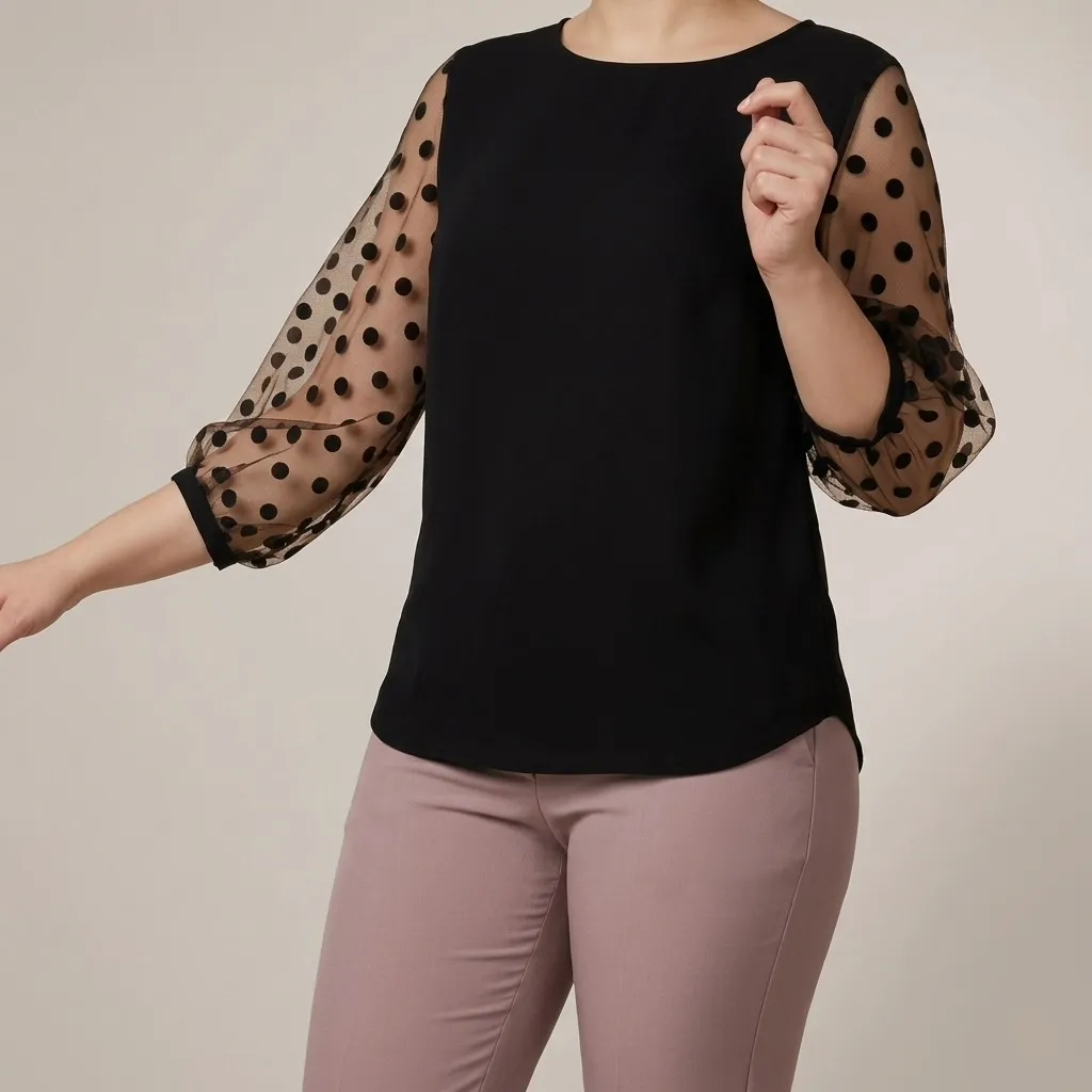 Black blouse with sheer polka-dot mesh sleeves