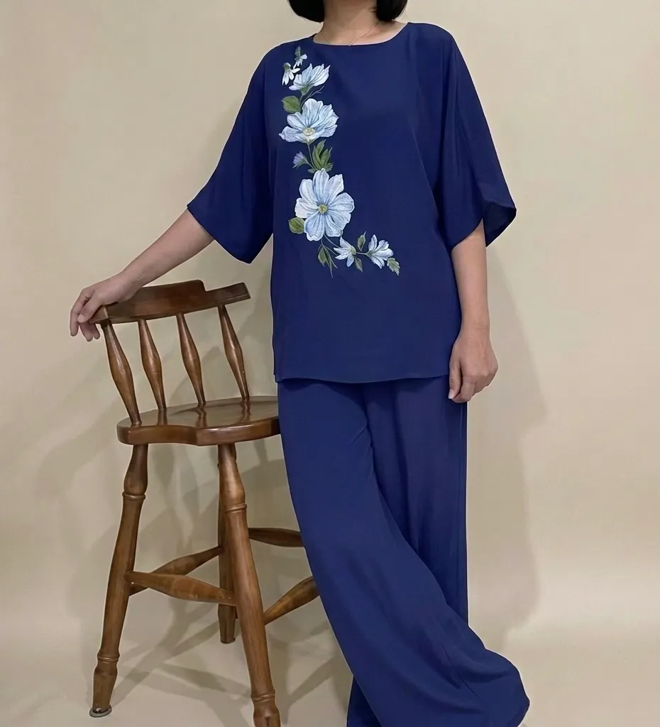 Navy two-piece set with floral embroidered top and wide-leg pants